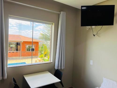 Et tv og/eller underholdning på Pousada Hilário ltda