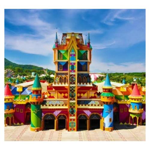 a large building with a colorful at Casa Sítio Campo e Mar Balneário Picarras in Piçarras