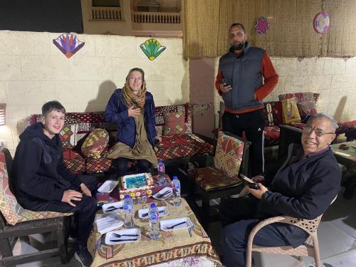 a group of people sitting in a room at Pyramids Lounge Guest House in Cairo