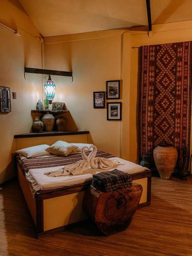 a bedroom with a bed in a room at Mintys Folly 2 in Ban Man