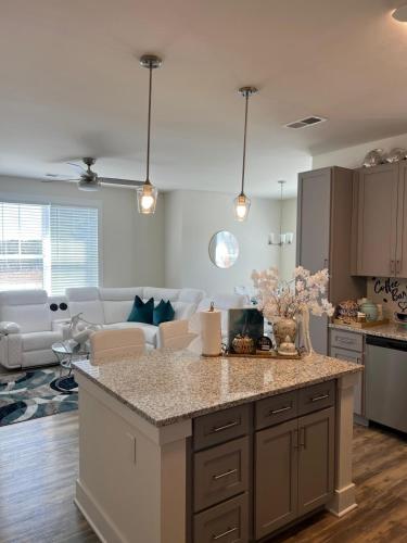 a kitchen and living room with a large counter top at Allstar Luxury Home LLC in Durham