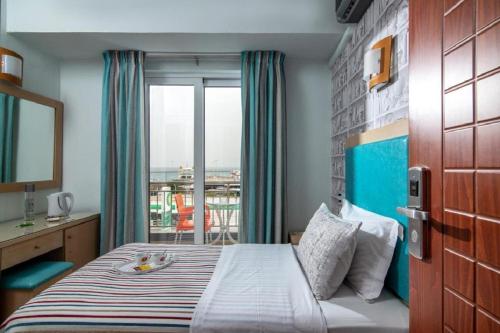Posteľ alebo postele v izbe v ubytovaní City Life Hotel