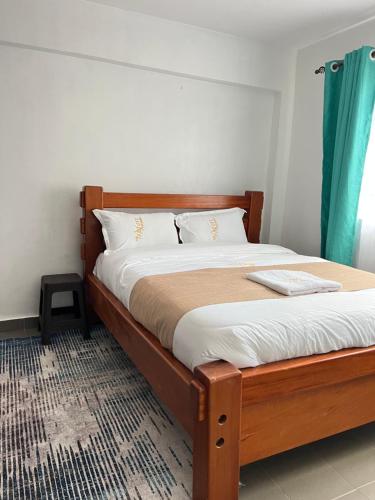 Ένα ή περισσότερα κρεβάτια σε δωμάτιο στο Stylish 2 bedrooms in kericho town