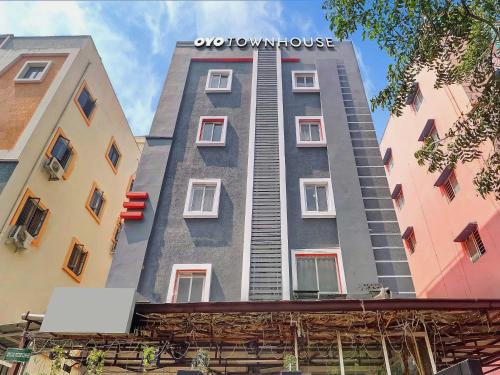 a tall apartment building with a sign on it at Super Townhouse RCC PARK VIEW INN in Hyderabad