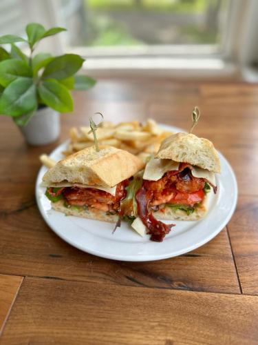 a plate with a sandwich and fries on a table at Bonnie View Inn in Haliburton