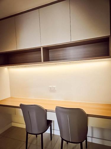 two chairs sitting at a desk in a room at SS KL Sentral by NomadNest in Kuala Lumpur