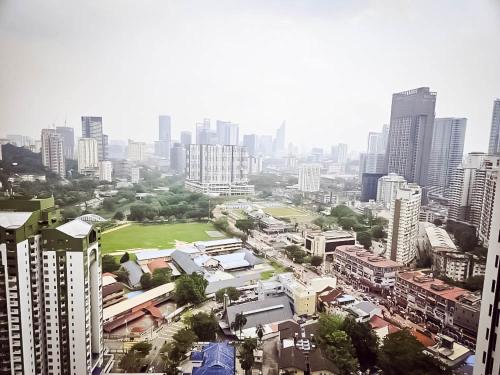 a view of a city with tall buildings at SS KL Sentral by NomadNest in Kuala Lumpur