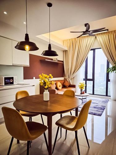 a kitchen with a table and chairs in a kitchen at SS KL Sentral by NomadNest in Kuala Lumpur