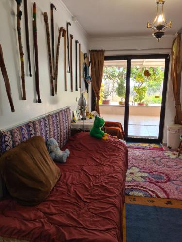 a bedroom with two stuffed animals sitting on a bed at Villa George - Family Holidays in Nea Makri
