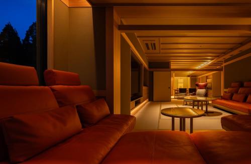a living room with a couch and a table at Kinzan in Kobe