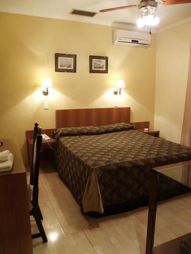 Postel nebo postele na pokoji v ubytování Hotel El Cabildo