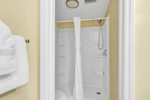 a bathroom with a shower with a shower curtain at Spectacular Oceanview Condos in Myrtle Beach