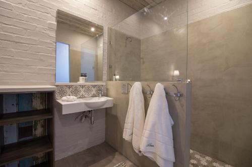 a bathroom with a sink and a mirror at The Quarter Deck in Kenton on Sea