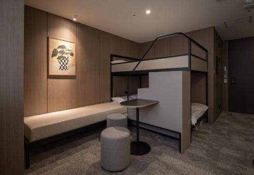 a hotel room with a bunk bed and a bunk bed at Extay Dongdaemun in Seoul