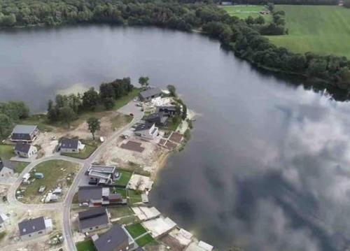 an island in the middle of a body of water at Ferienhaus Bella in Barßel