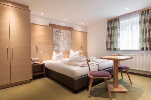 Posteľ alebo postele v izbe v ubytovaní SCHMID Rooms & Apartments