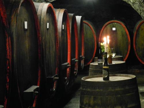 a row of wine barrels in a wine cellar at Weingut Stassen in Oberheimbach