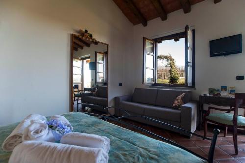 Postel nebo postele na pokoji v ubytování Agriturismo Cascina Aguzza