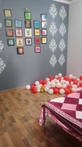 a room with a bunch of balls on the floor at Aadya's Blessed Home in Prayagraj
