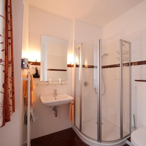 a bathroom with a shower and a sink at Hotel Ochsen in Überlingen