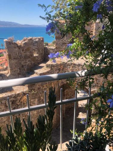a view of the ocean from the ruins of a building at Sideroporta castle Náfpaktos in Nafpaktos
