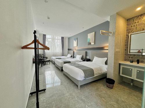 Postel nebo postele na pokoji v ubytování Bohol Panglao Begonia Resort