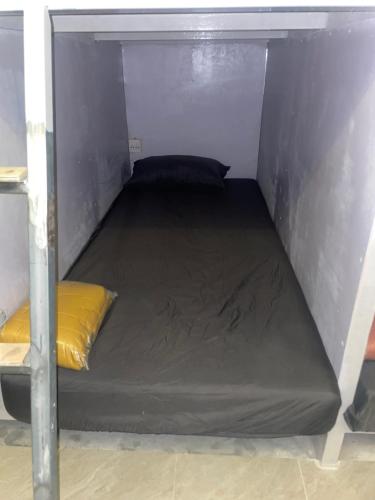 a small room with a bed in the corner at Noahs Ark in Amphoe Koh Samui