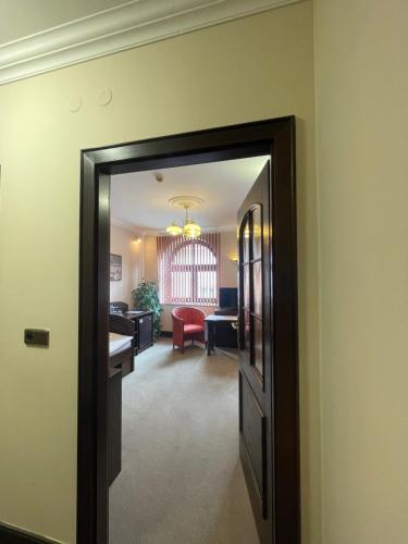 a hallway with a door leading to a living room at Hotel Bravo in Česká Třebová