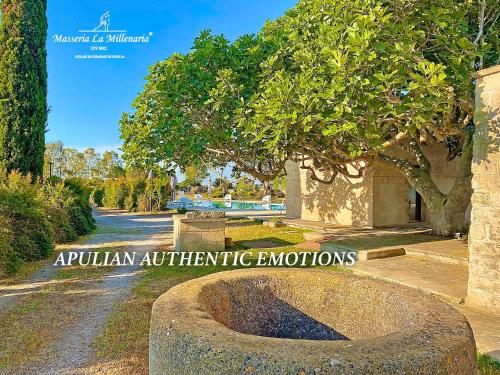 a park with a sign that reads amphibian authentic emotions at Masseria La Millenaria in San Foca
