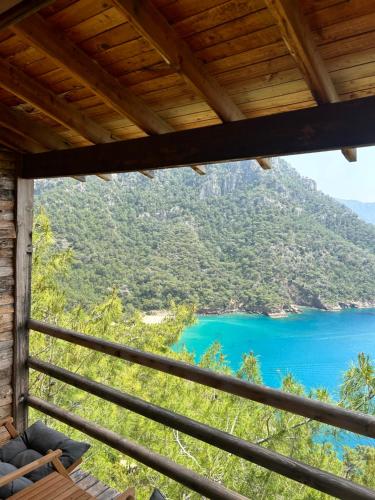 a view of a lake from a cabin at Kabak Ütopya Kamp in Faralya