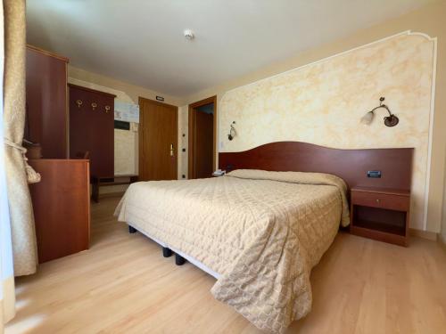 Postel nebo postele na pokoji v ubytování Hotel Dama Bianca