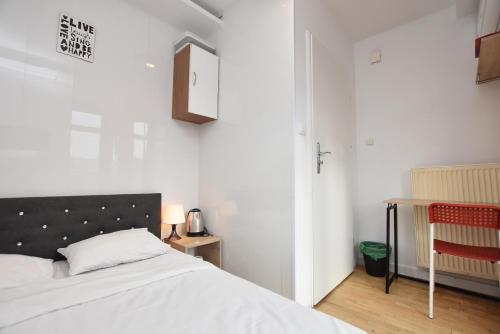 Katil atau katil-katil dalam bilik di City Central Hostel - Pokoje prywatne
