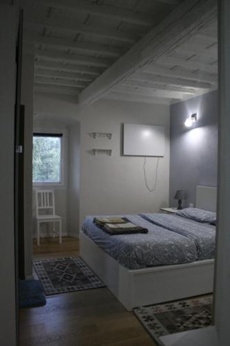 a bedroom with a bed and a basketball hoop on the wall at Allie's flat in Antella