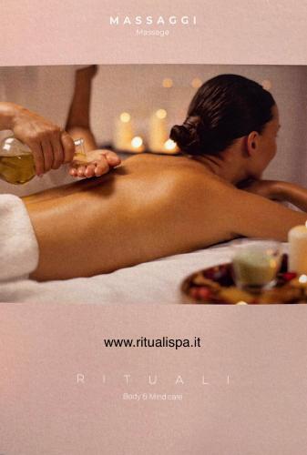 a woman laying in a bath tub getting a massage at Franca’s dream - Bellagio in Bellagio