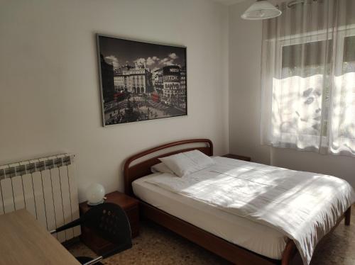 Giường trong phòng chung tại Coretti Rooms