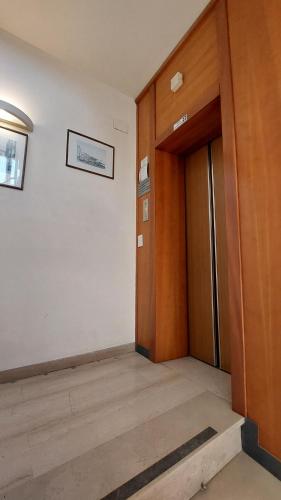 an empty room with a door and a hallway at Hotel Etrusco in Sesto Fiorentino