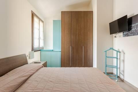 Кровать или кровати в номере Anto Home Appartamento Viddalba