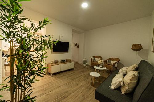 a living room with a couch and a table at Casa Paca in Olvera