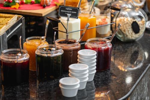 a group of jars of jam on a counter at Empire Balneo & Spa Hotel in Hisarya