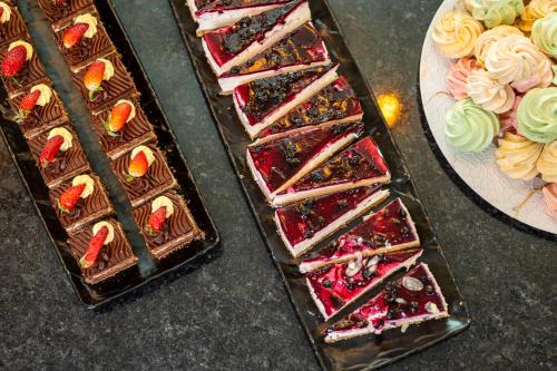 three different types of chocolate desserts on a table at Empire Balneo & Spa Hotel in Hisarya