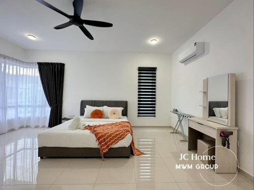 a bedroom with a bed and a ceiling fan at Kluang Gunung Lambak view Family Suites in Kluang