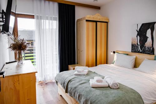 Katil atau katil-katil dalam bilik di Domek Kordoń SPA Jacuzzi & Sauna