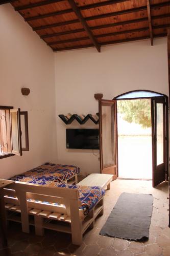 a room with two beds and a window at Noah's Ark in Dahab