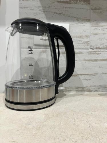 a black coffee pot sitting on a counter at Casa nel vicolo in Montichiari