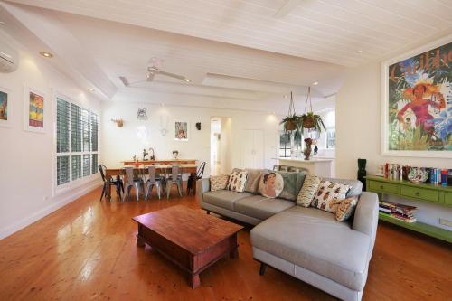 a living room with a couch and a table at 3 bdrm house in CBD sleeps 6 in Warrnambool