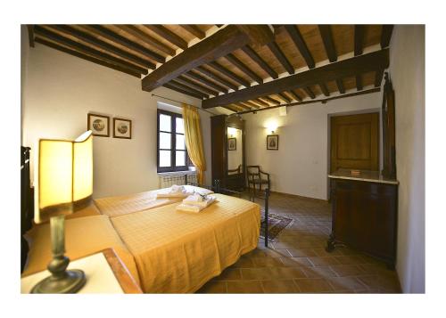 a bedroom with a bed in a room at Podere Suvignano in Murlo