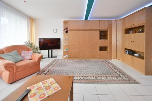 TV a/nebo společenská místnost v ubytování FeWo Sandrock Nr 13 Solmare