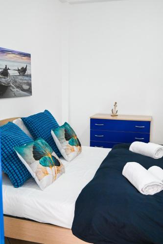 Postel nebo postele na pokoji v ubytování La casa azul - Jacuzzi clima netflix -
