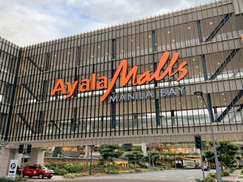 aania melks sign on the side of a building at Casa Josefina in Manila