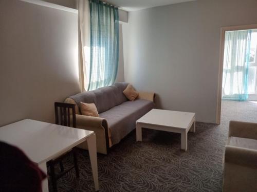 a living room with a couch and a table at Hanzade Turizm in Istanbul